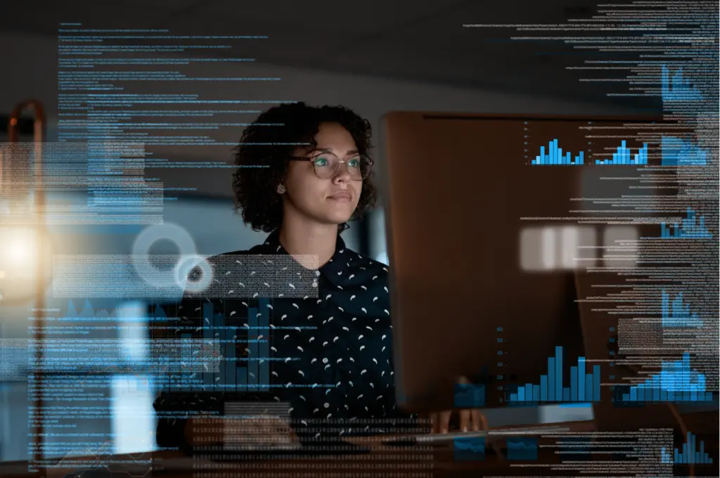 Professional analyzing data on computer screen.