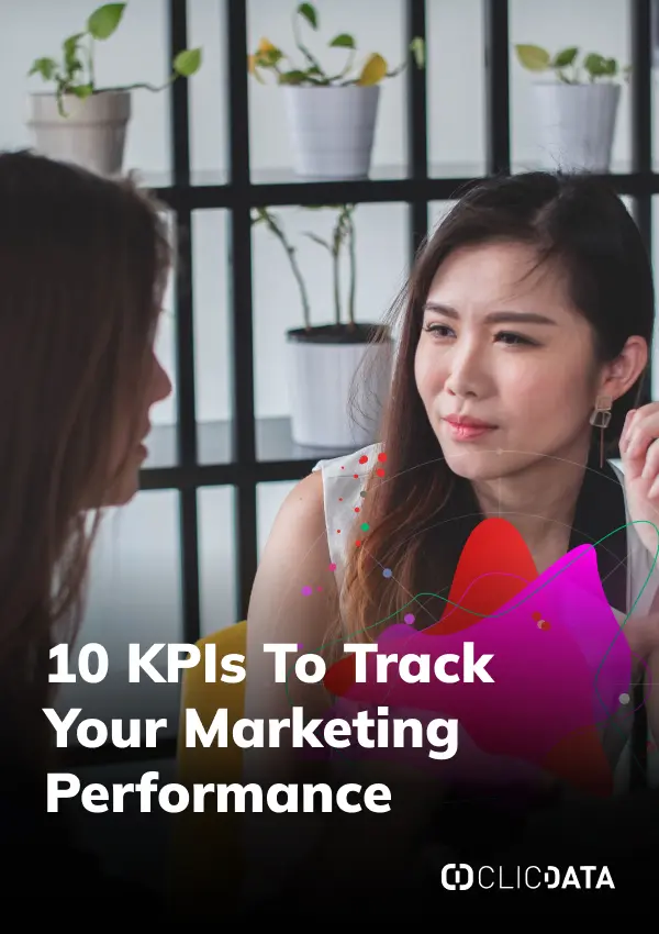 Two women discussing marketing performance KPIs.