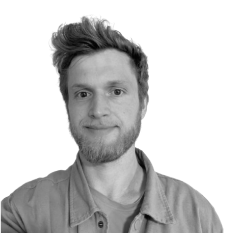 Man smiling in casual shirt, monochrome photo