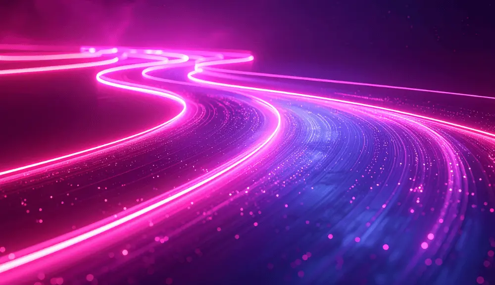 Neon pink swirling light trails in darkness